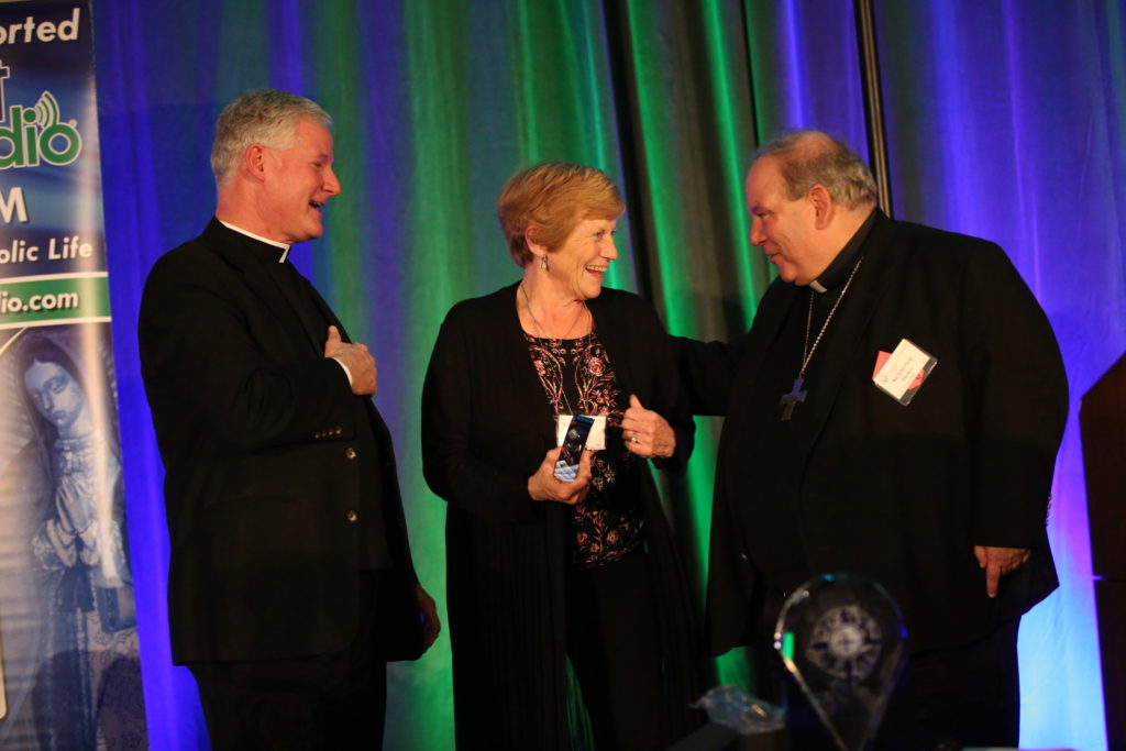 Father Rocky, Mary Jo Feltl, and Archbishop Bernard Hebda