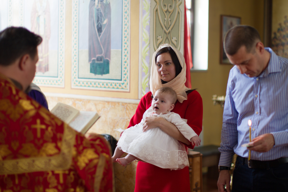 child with godparents