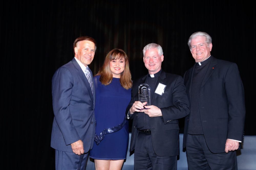 Father Rocky receives award
