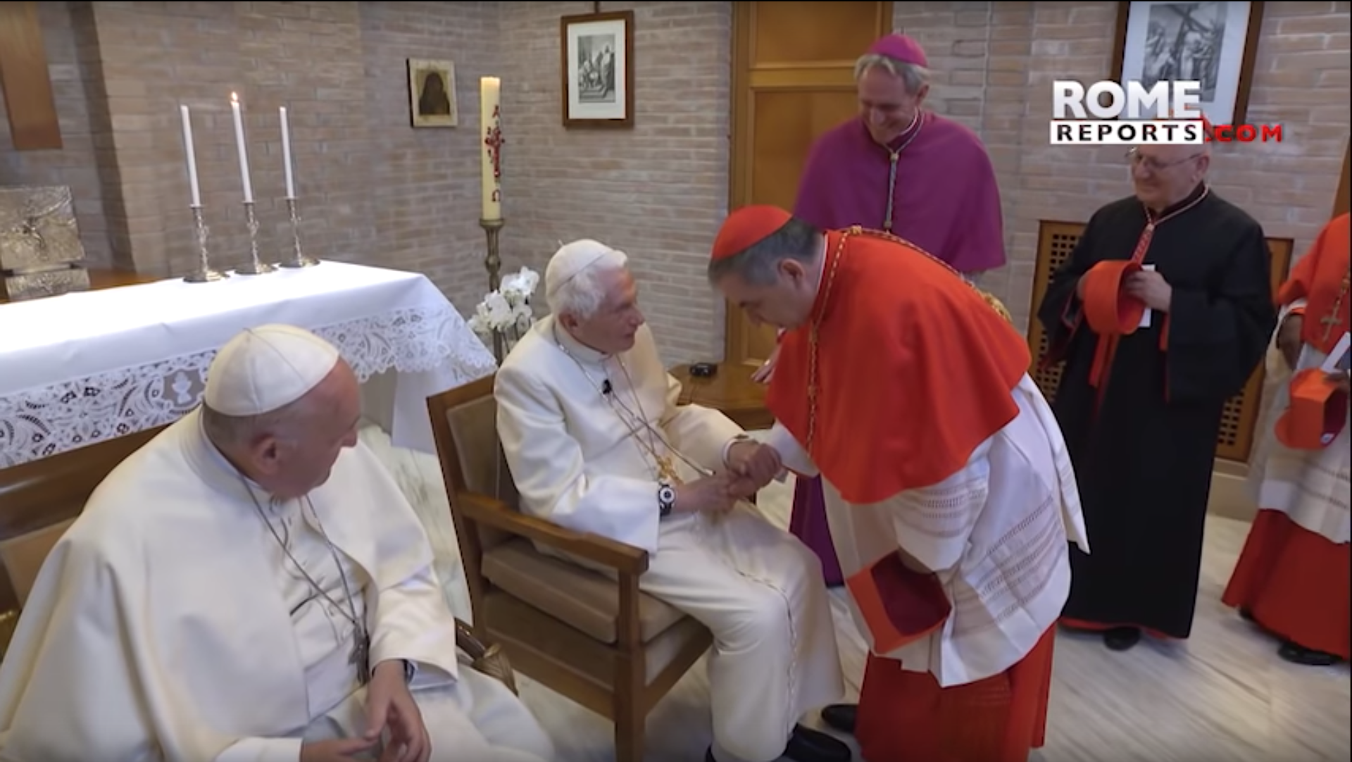 Pope Emeritus Benedict XVI greets new cardinal
