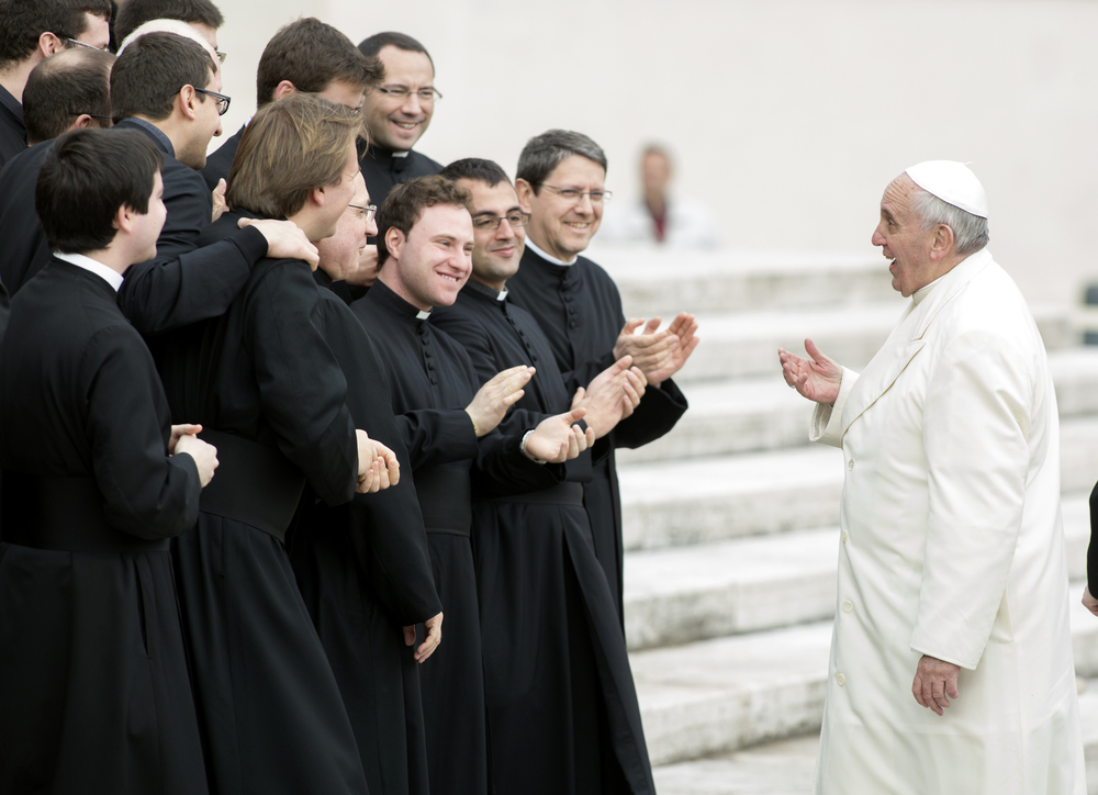 Pope Francis greets a group of priests in Rome