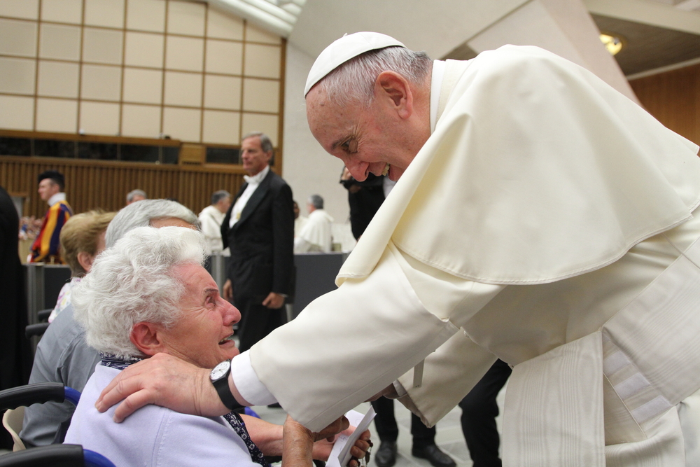 Pope Francis greets elderly woman in wheelchair