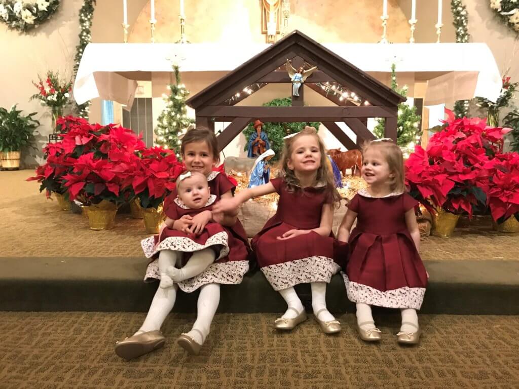 Four girls with Nativity Set