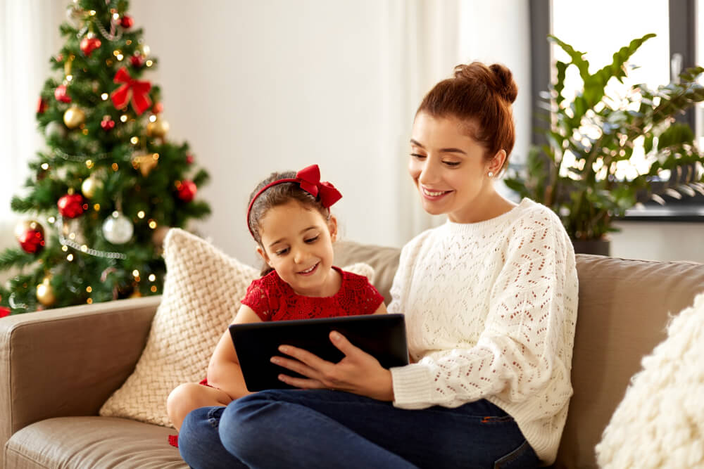 Mom and daughter use new tablet at Christmas