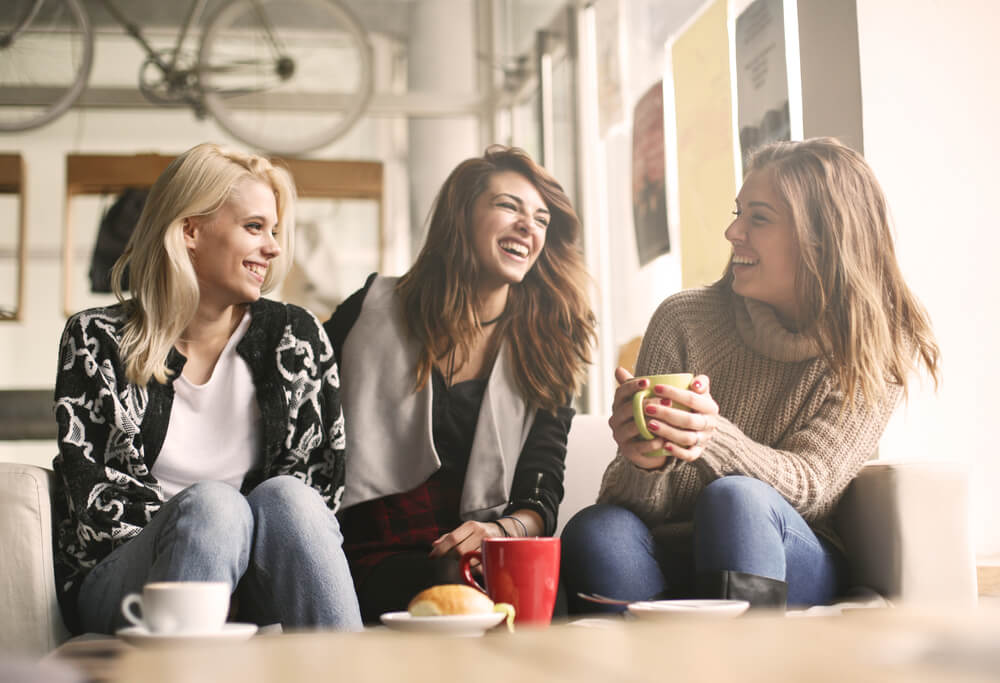 young women laughing and talking