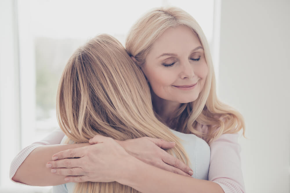 daughter hugs mom