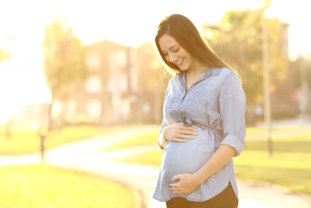 young woman with baby bump