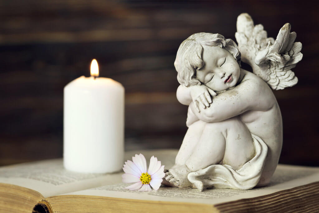 Angel statue and candle