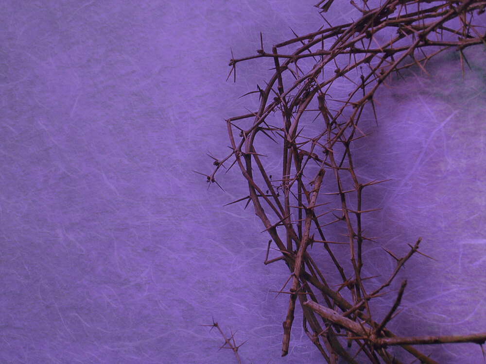 purple Lent background with crown of thorns