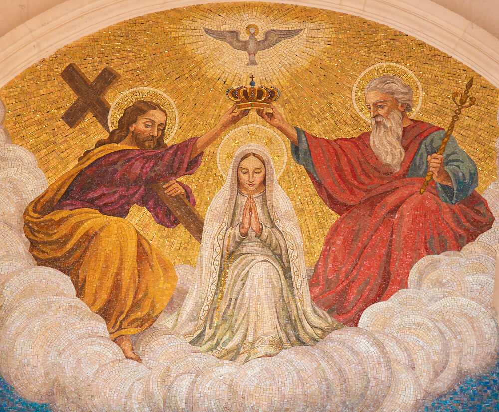 Mary being crowned by Jesus and God the Father