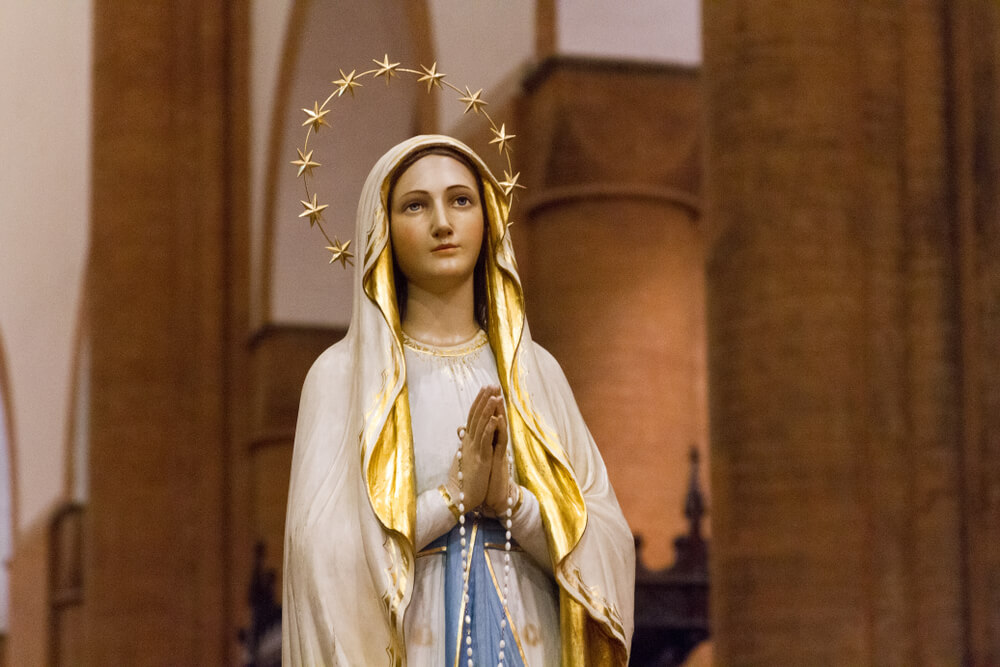 Virgin Mary statue wearing veil
