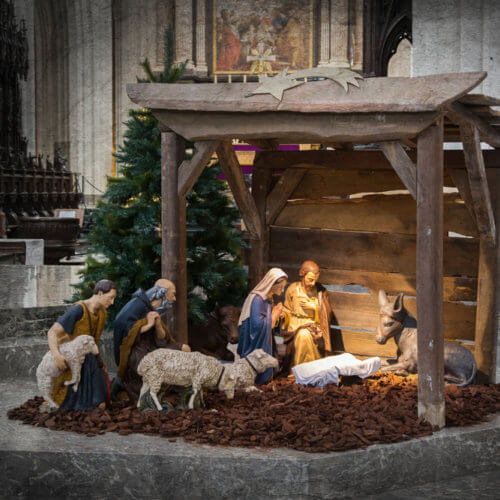 Nativity scene with empty manger for advent