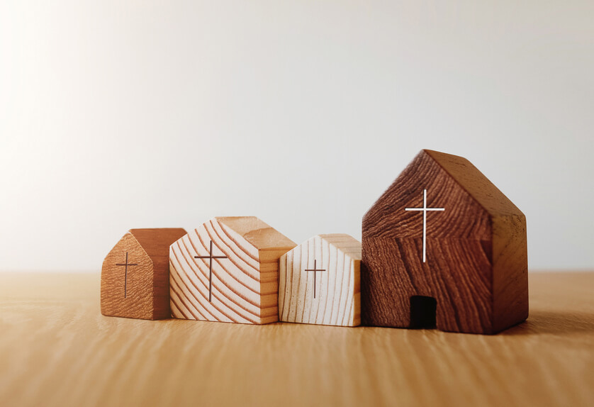 Images of toy homes with crosses on them