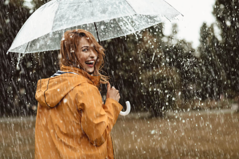 Woman in the rain full of joy