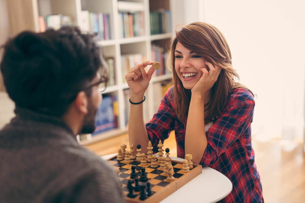 Couple plays chess together for date night
