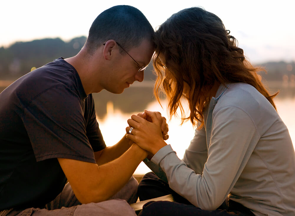 Husband and wife pray together, he acts as spiritual head of his household
