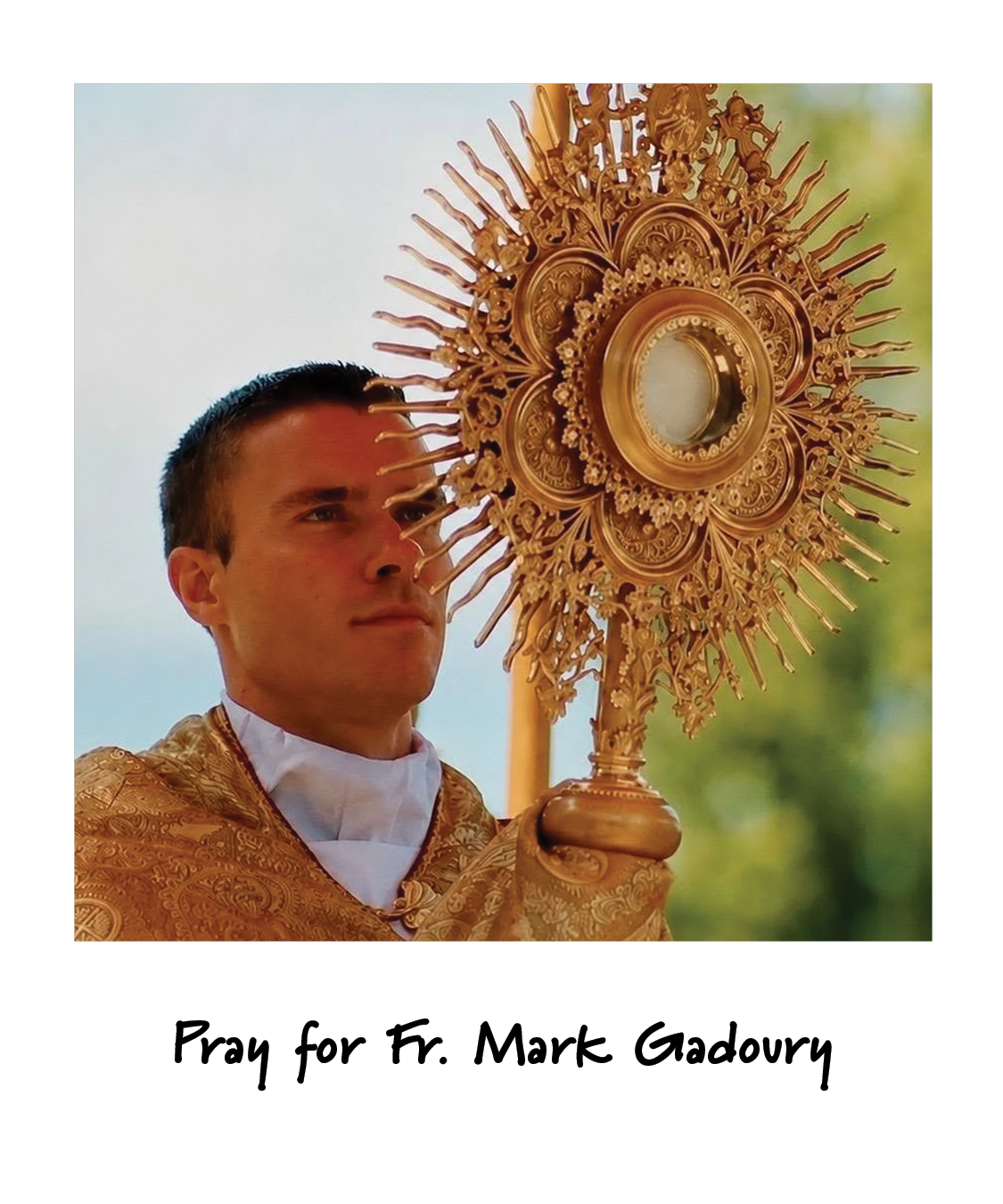 A priest holding a monstrance, captioned: Pray for Fr. Mark Gadoury.