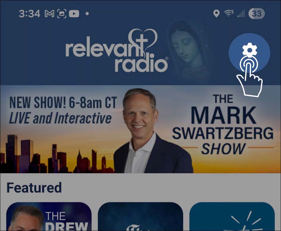 The app home screen with the Settings gear icon highlighted in the upper right corner.